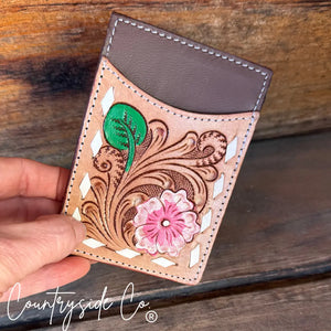 Tooled leather credit card holder with pink flower and green leaf detail. "Countryside Co."