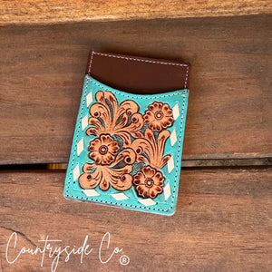 Turquoise tooled leather credit card holder with floral pattern and brown leather top.