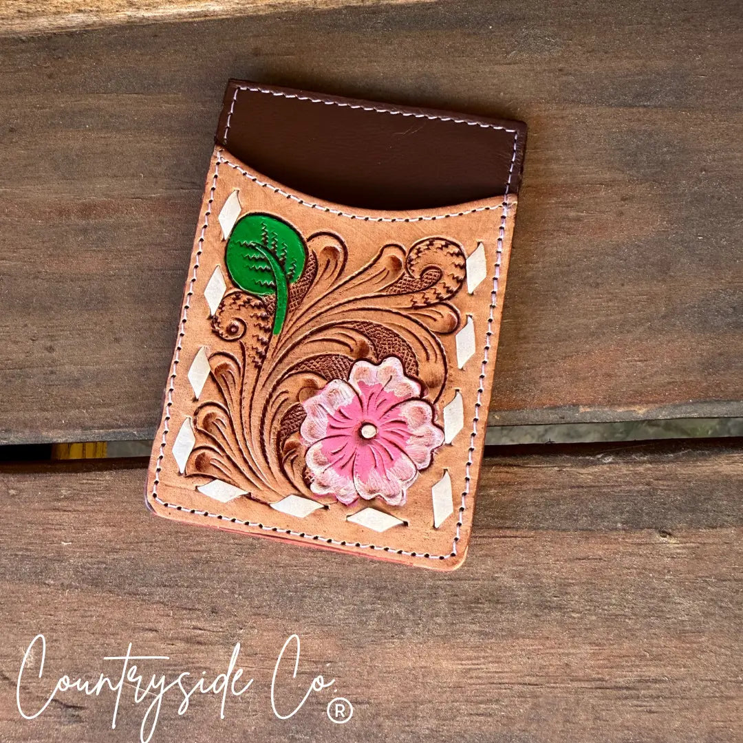 Western floral tooled leather credit card holder with pink flower detail.