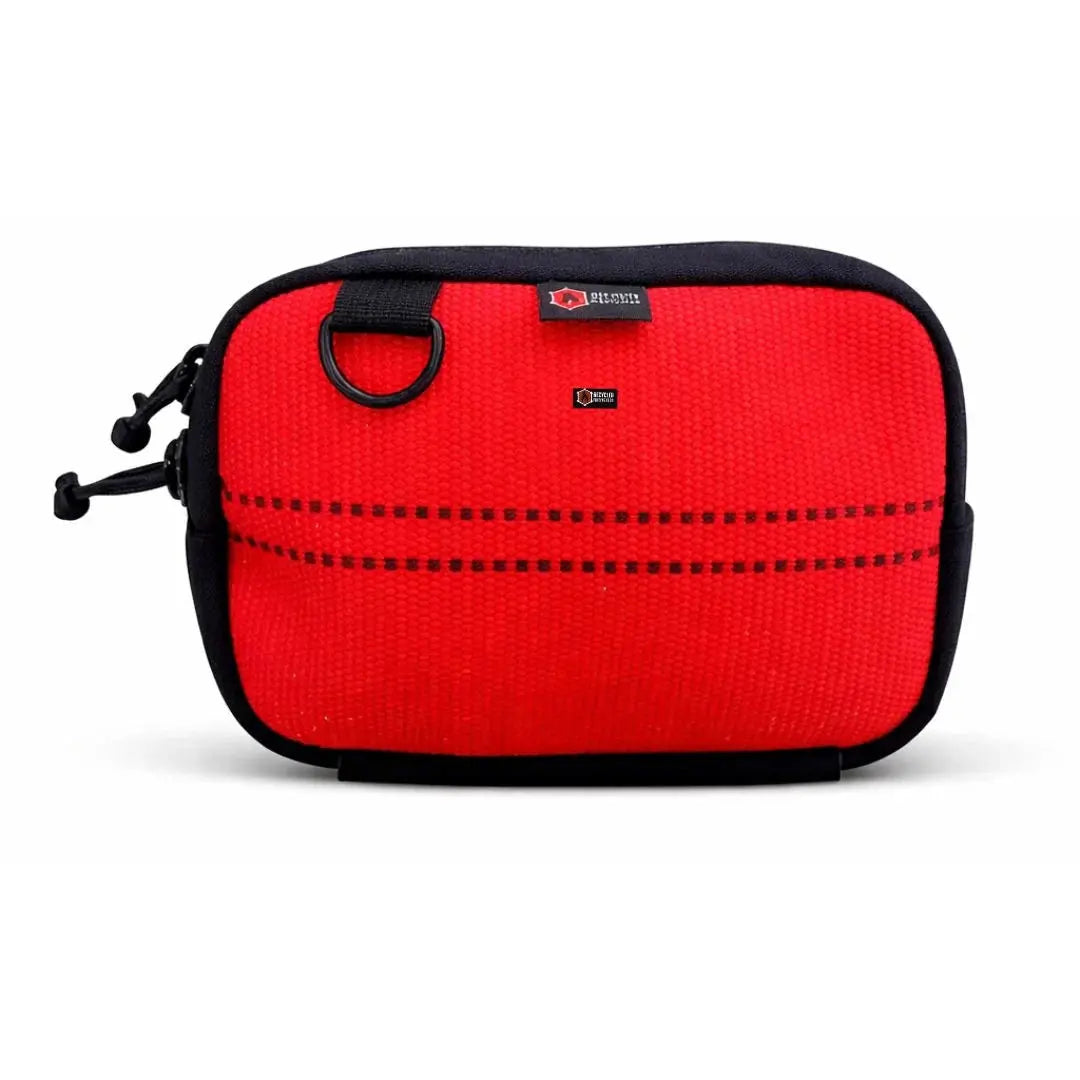 Red fanny pack with black trim and D-ring detail