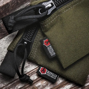 Olive green medium zippered pouch with Recycled Firefighter logo tag