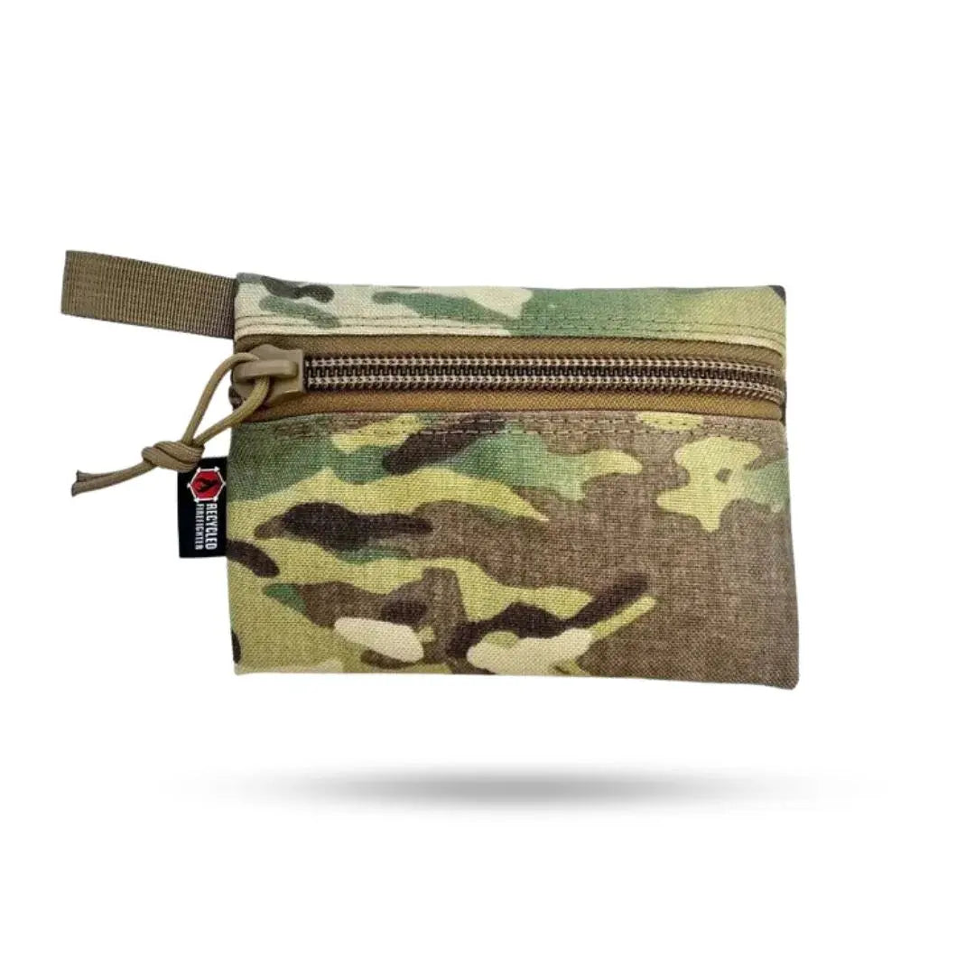 Camouflage flat zippered pouch with a small red and black logo tag.