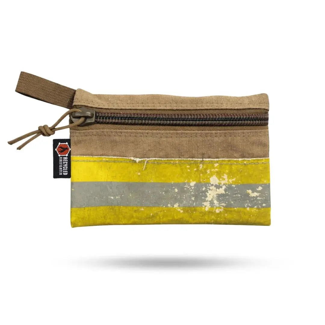 Tan pouch with yellow and silver reflective stripes made from recycled firefighter bunker gear.