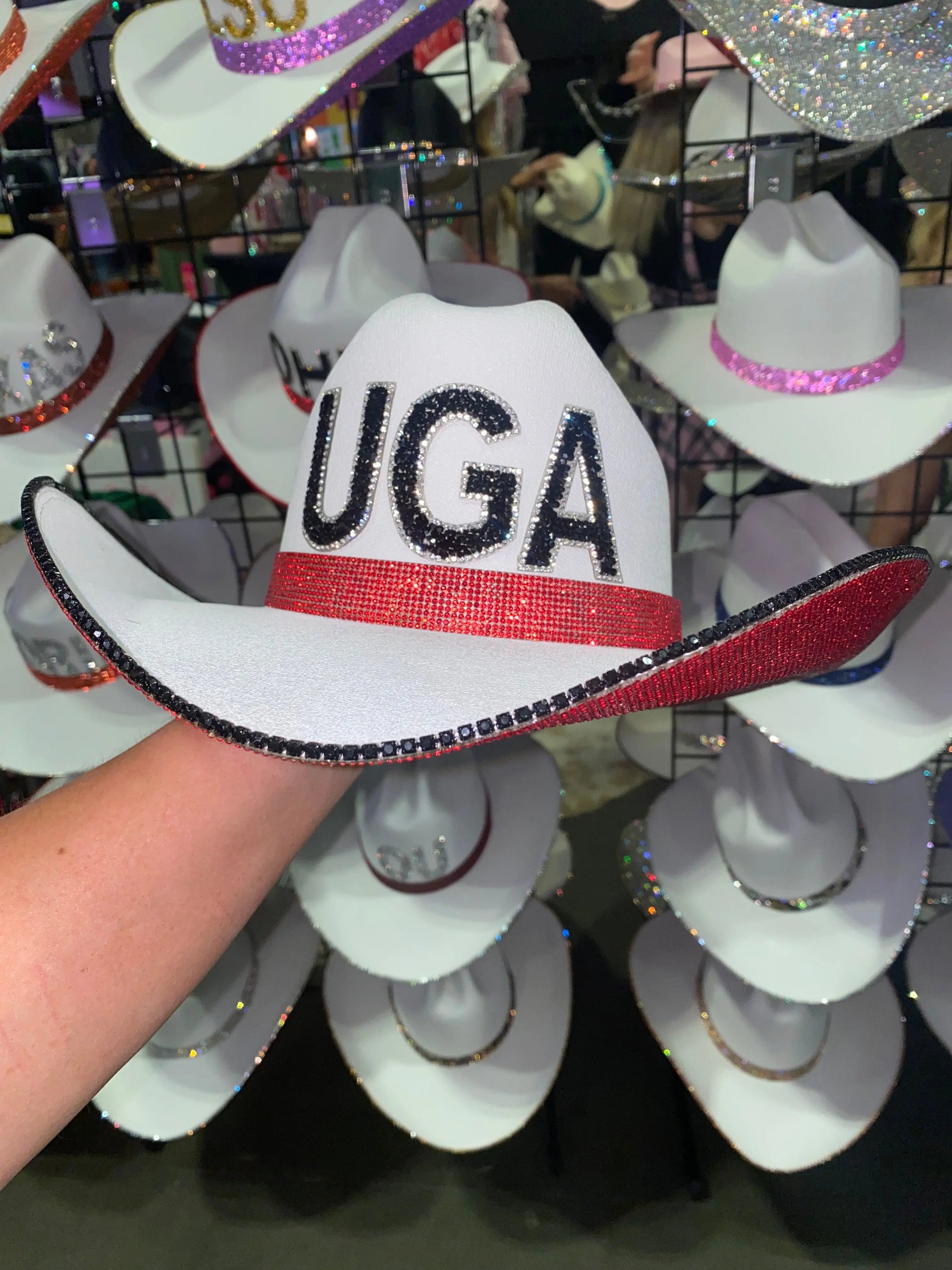 White UGA cowboy hat with red and black rhinestone embellishments.