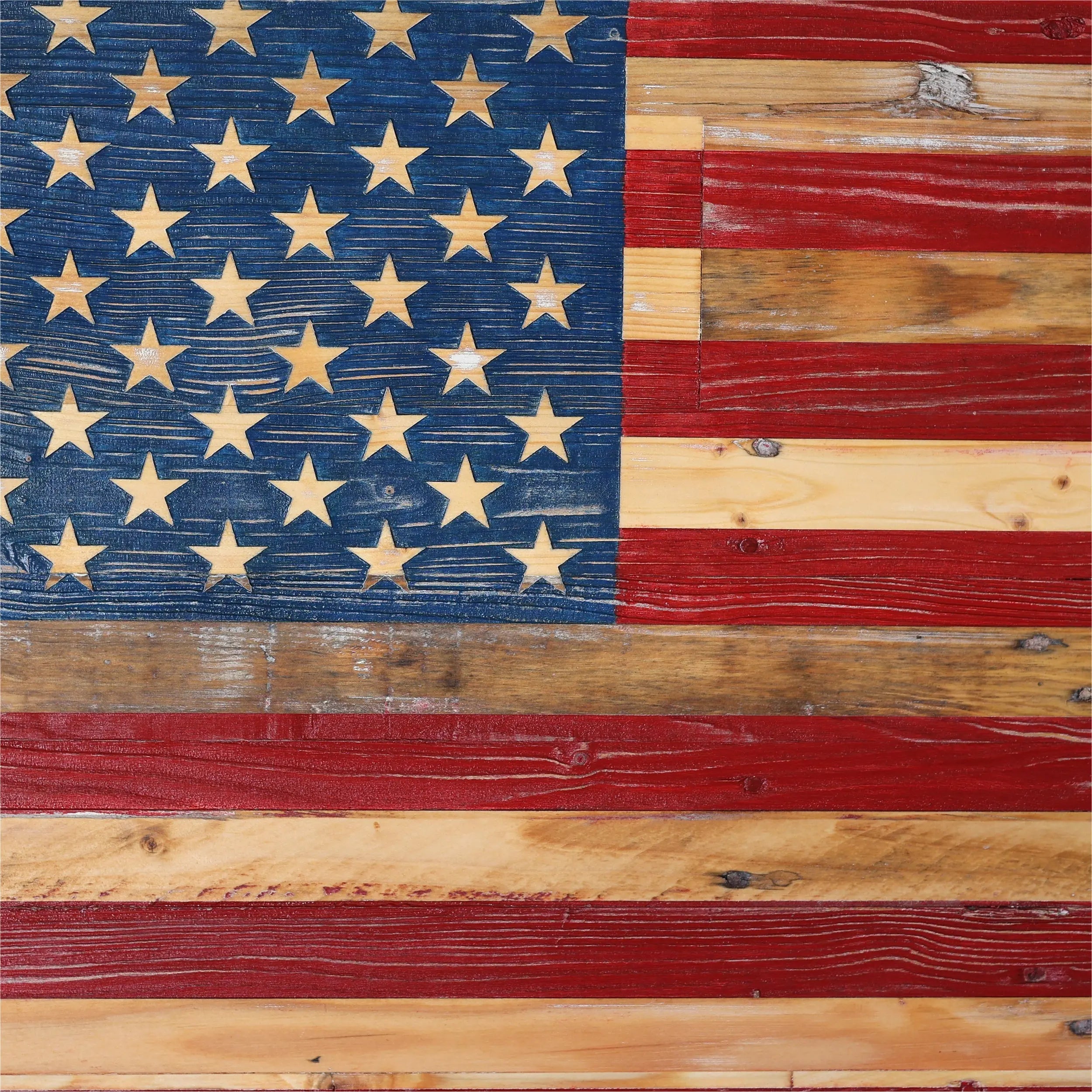 Rustic wooden American flag with hand-painted stars and stripes.