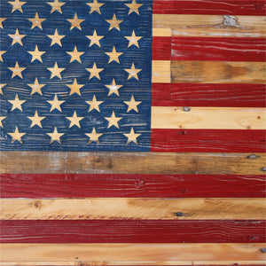 Rustic wooden American flag with hand-painted stars and stripes.