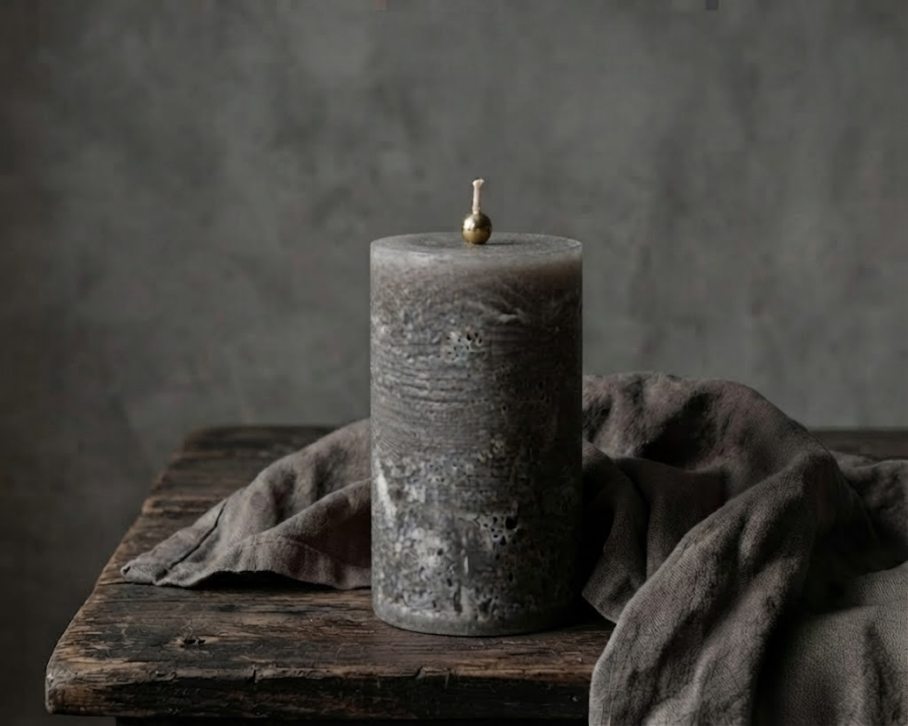 Gray textured pillar candles by Believe Candle in multiple heights