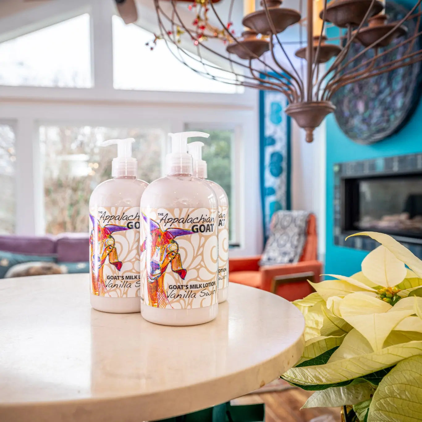 Two bottles of Appalachian Goat Vanilla Swirl Goat's Milk Lotion on a table