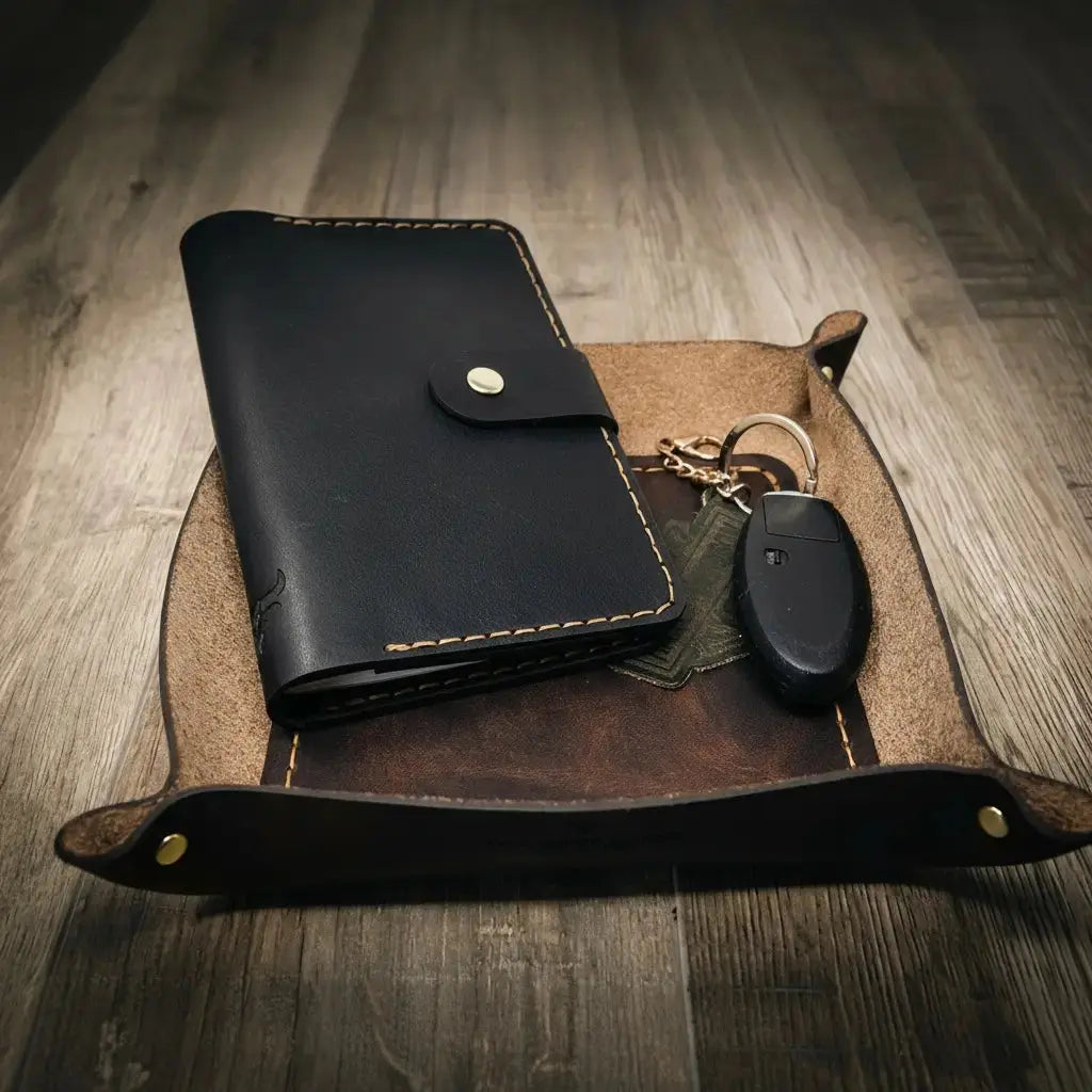 Main Street Collective leather valet tray holding a black wallet and car keys.