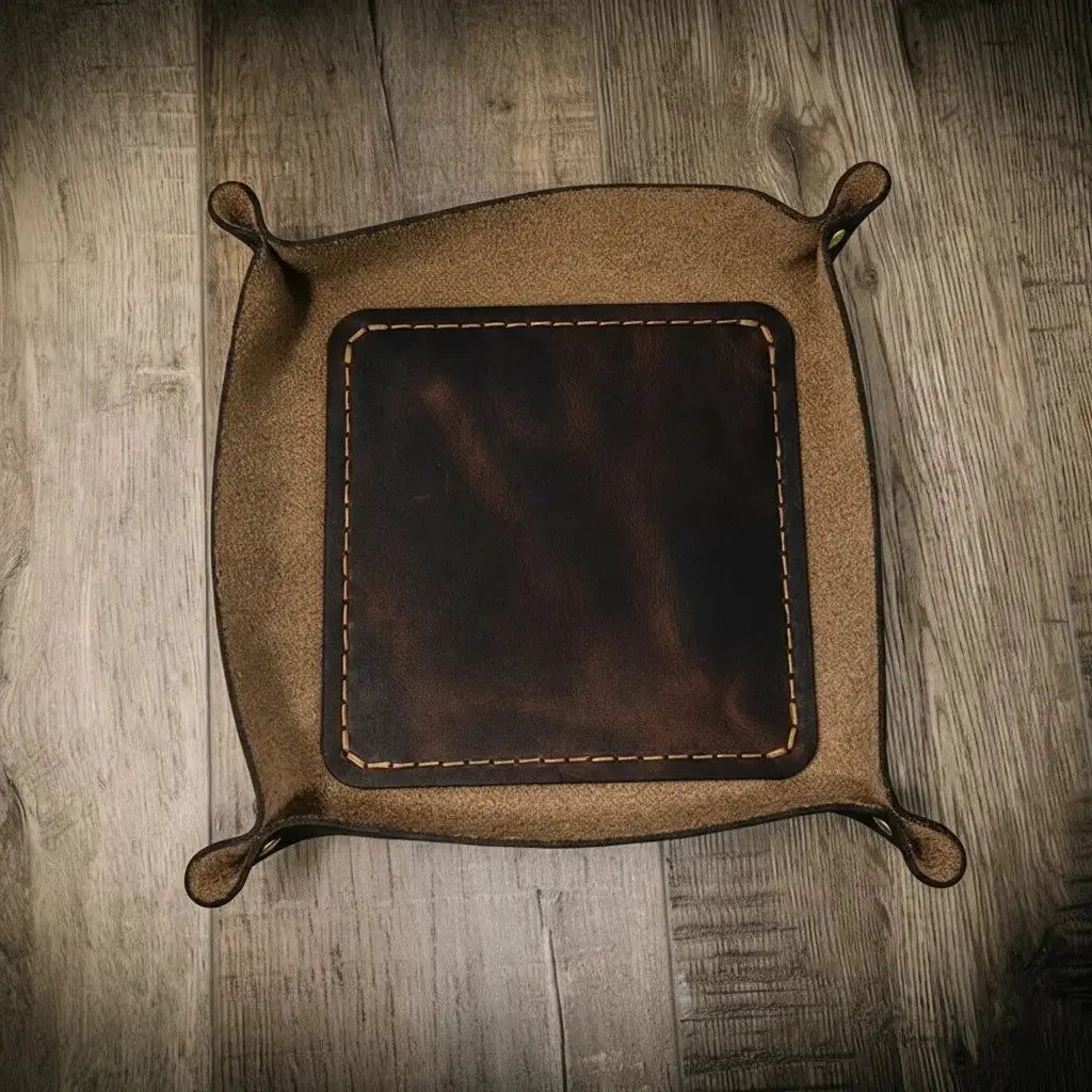 Brown bull sheath leather valet tray for organizing small items.
