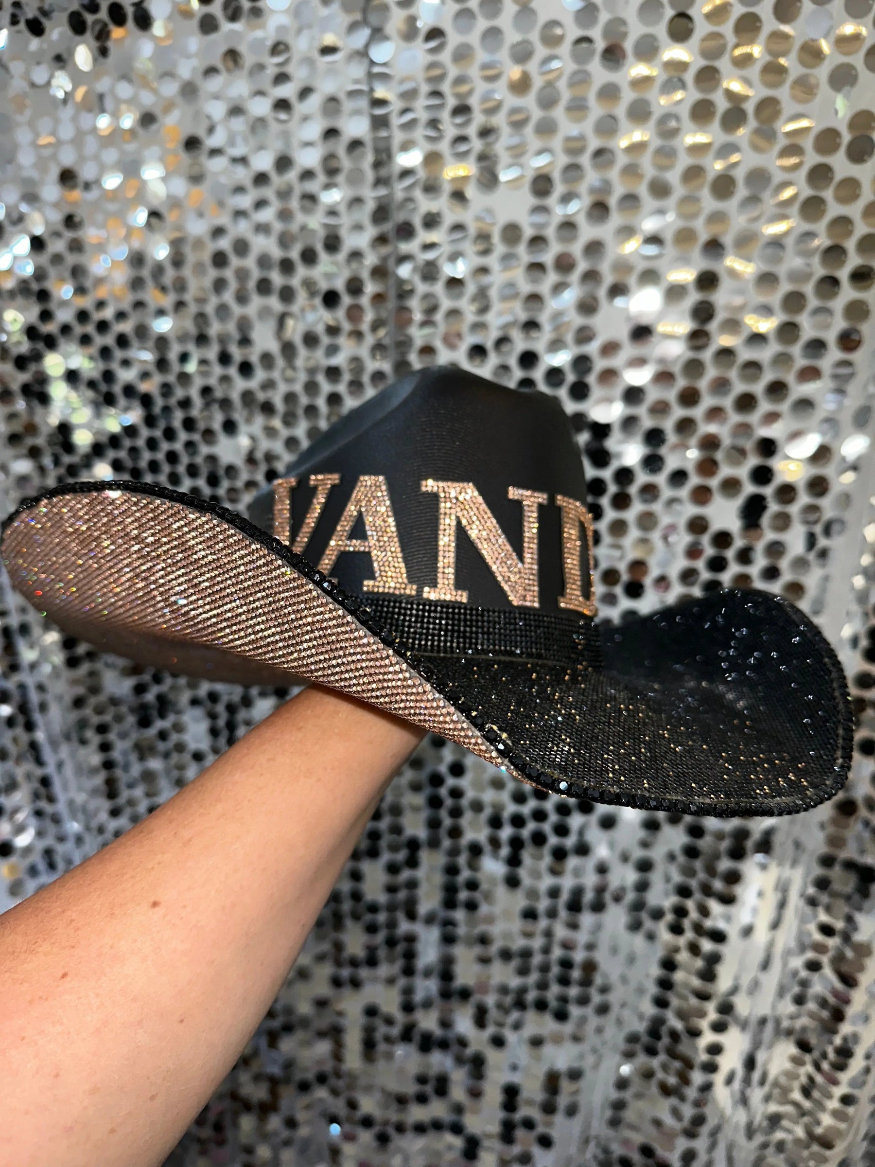 Black cowboy hat with champagne and black rhinestones and "VANDY" text.