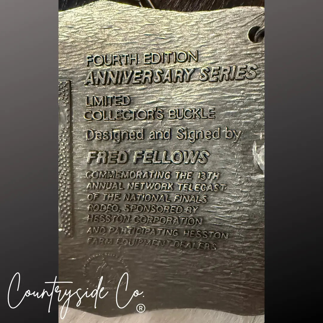 Engraved metal buckle with text: "Fourth Edition Anniversary Series Collector's Buckle Fred Fellows".
