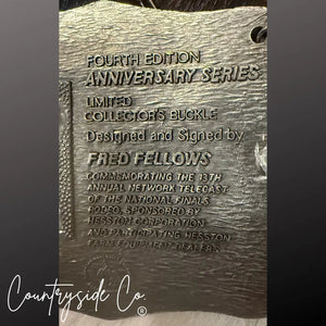 Engraved metal buckle with text: "Fourth Edition Anniversary Series Collector's Buckle Fred Fellows".