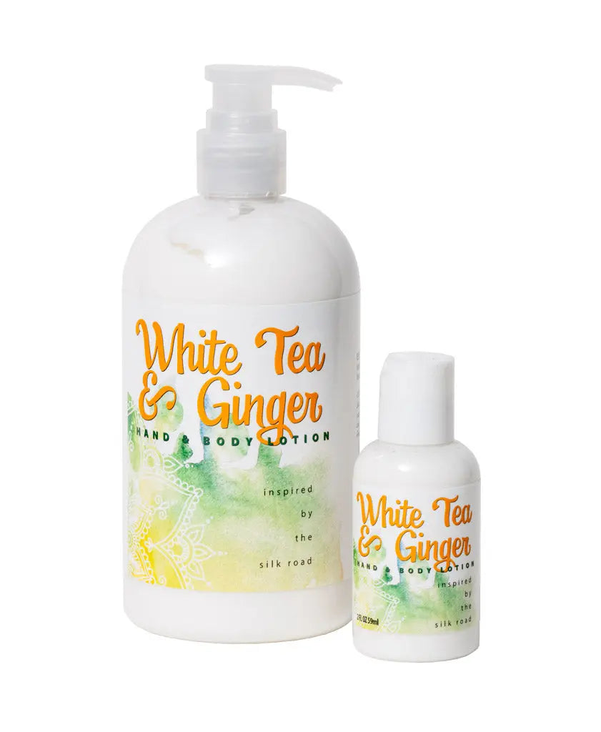 Two white lotion bottles with "White Tea & Ginger" labels and pump dispensers.