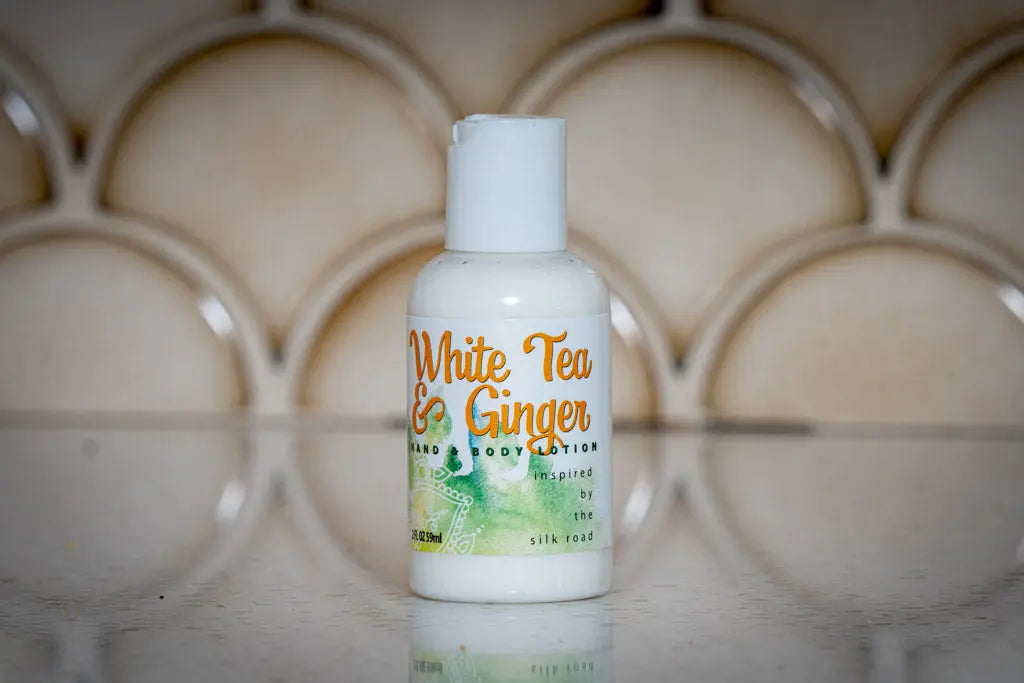 White Tea & Ginger hand and body lotion bottle, travel size.