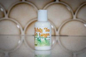 White Tea & Ginger hand and body lotion bottle, 2 oz travel size.
