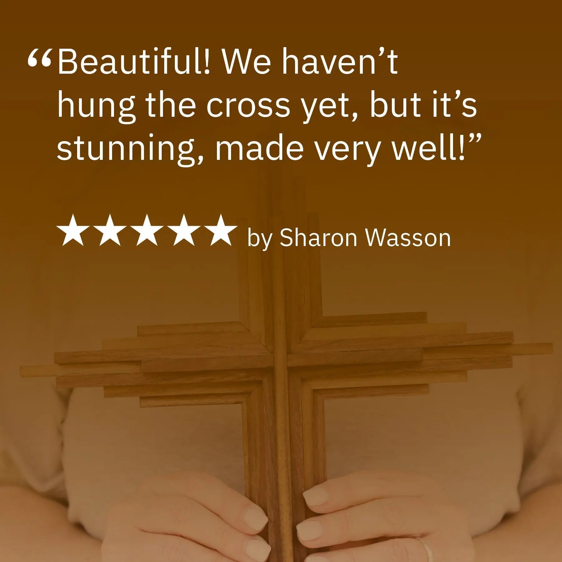 Wooden layered cross held by hands