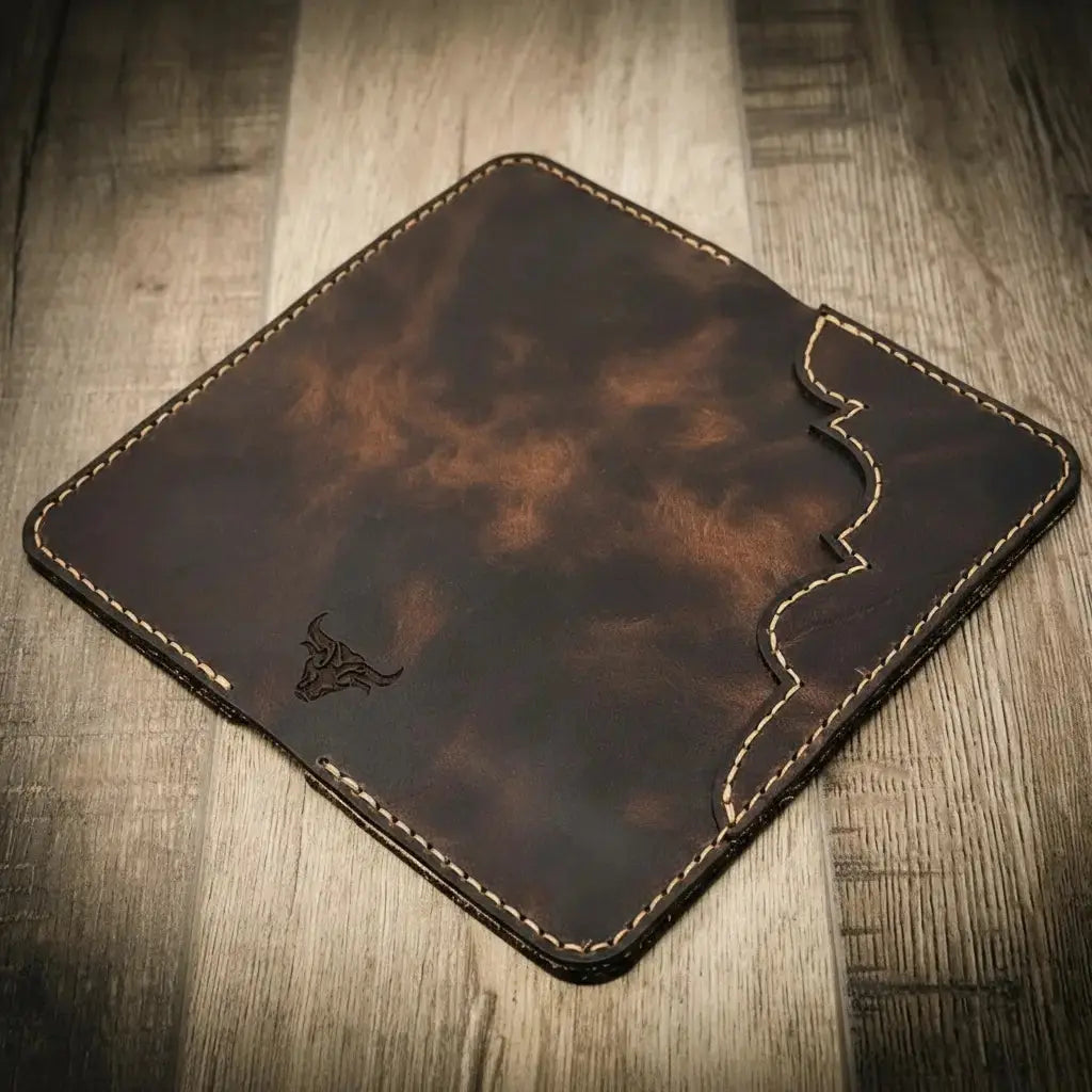Brown full-grain leather long wallet with stitched edges and a bull logo.