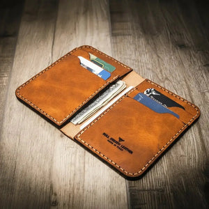 Brown leather vertical bifold wallet with card slots and cash pockets
