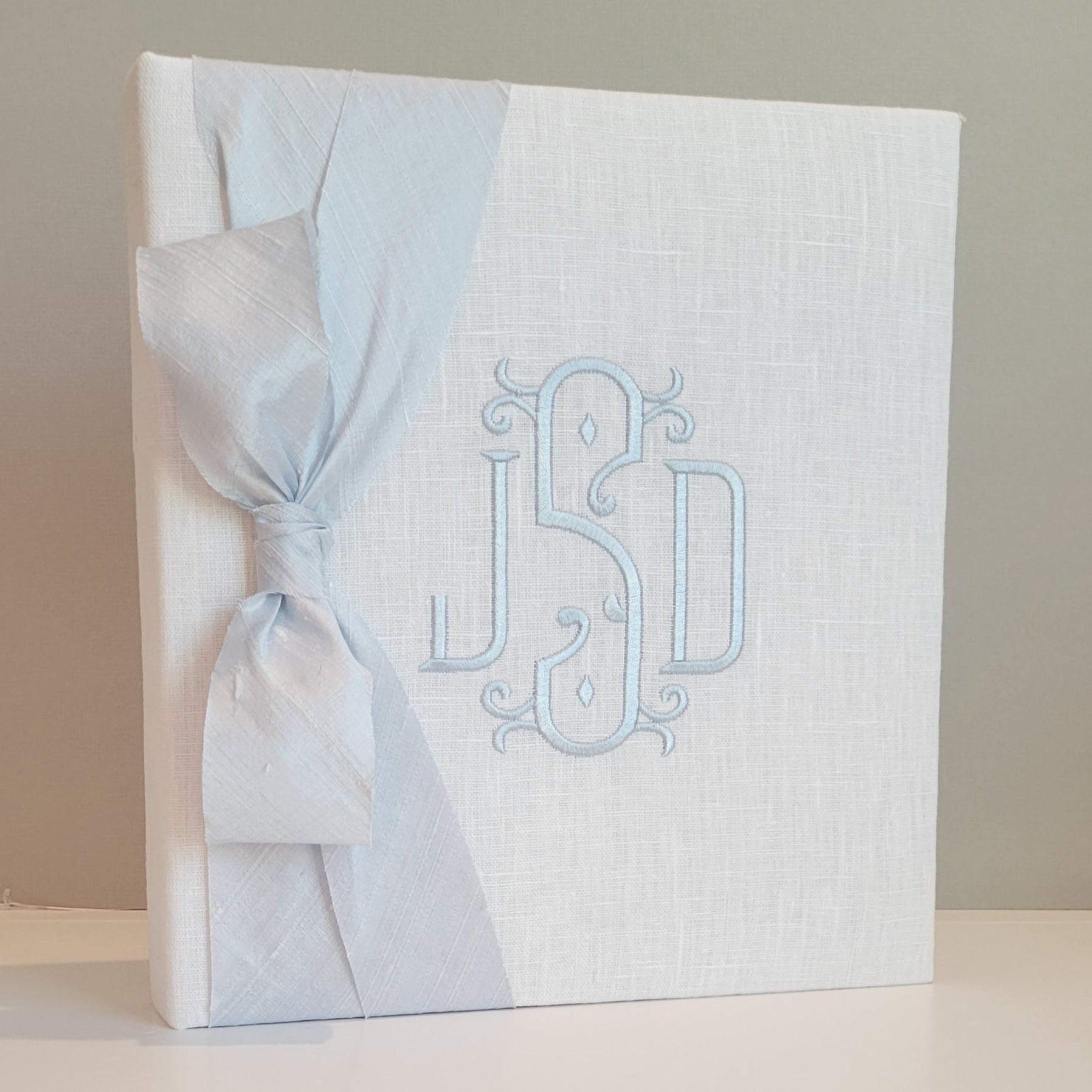 White linen handmade baby memory book with silk bow by AP Creations
