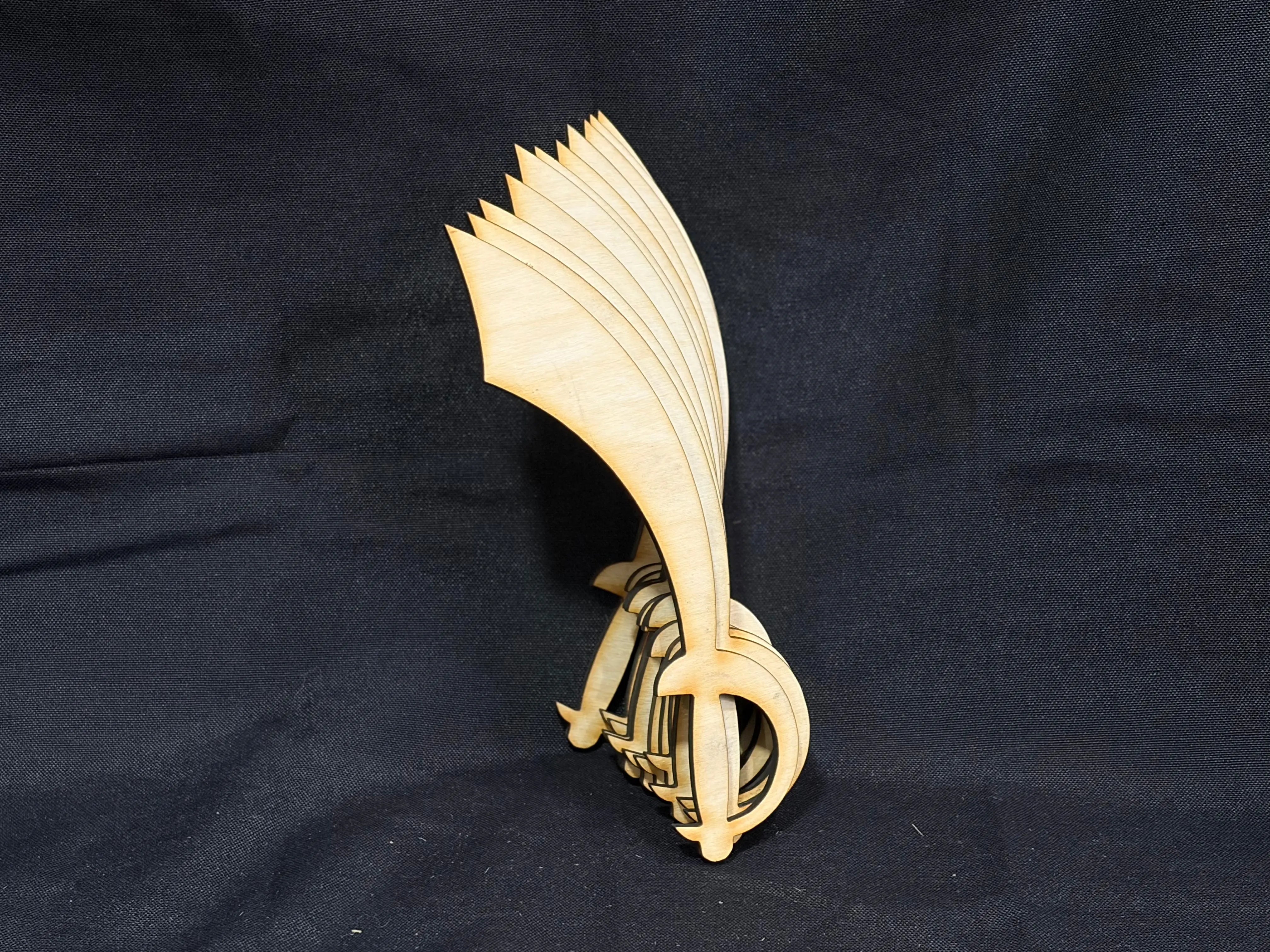 Wooden pirate sword cutouts stacked against a dark background.