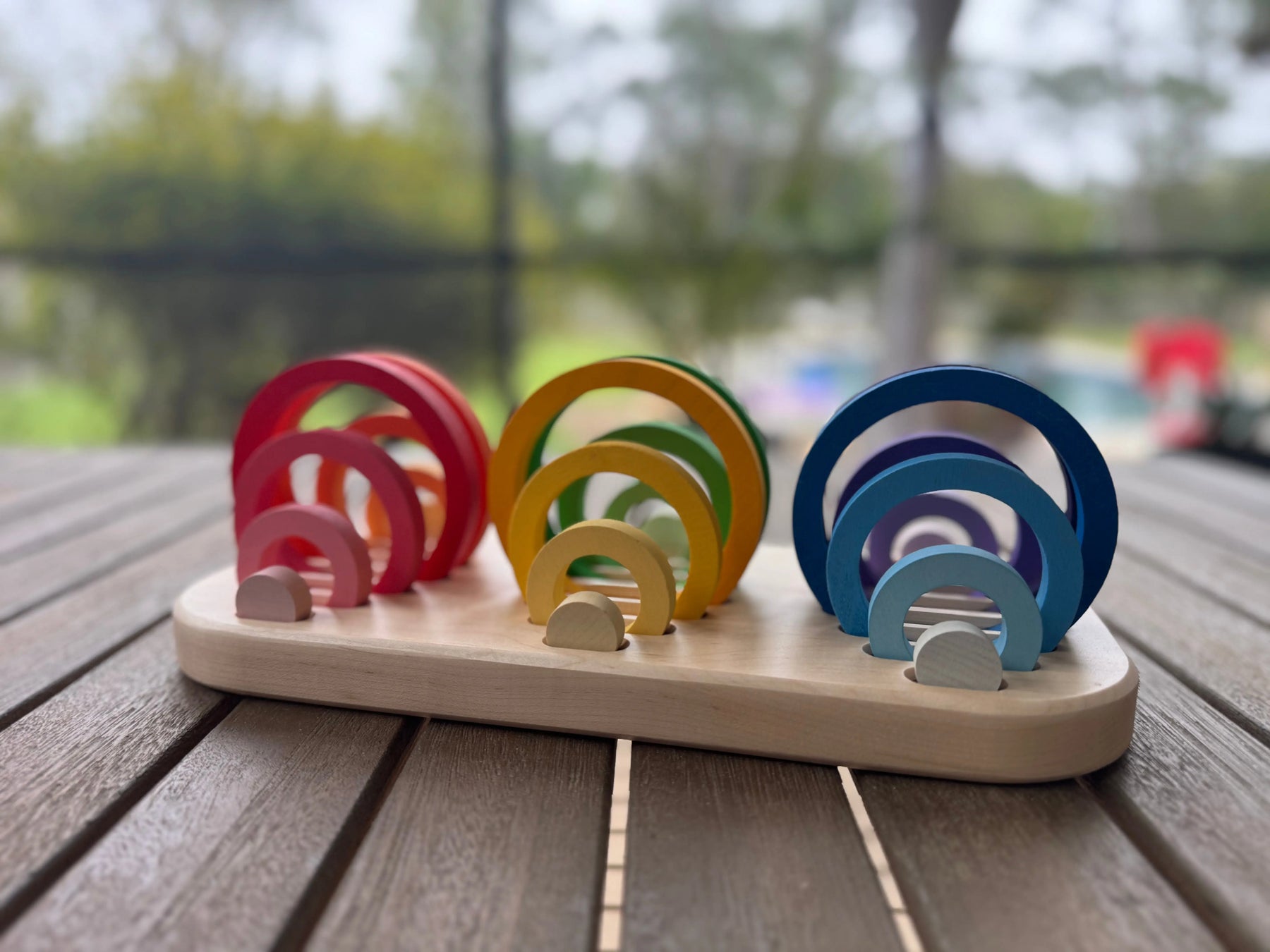 Wooden tray for Grapat Nest Rings in a Montessori inspired playroom setup