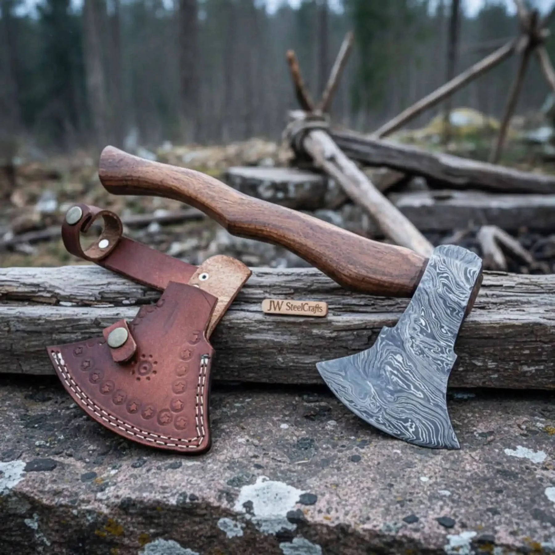 Damascus steel axe head with wood handle on rustic wood surface