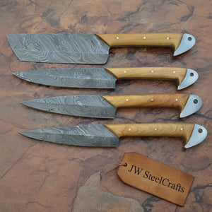 Handmade damascus steel knife with premium handle on dark surface