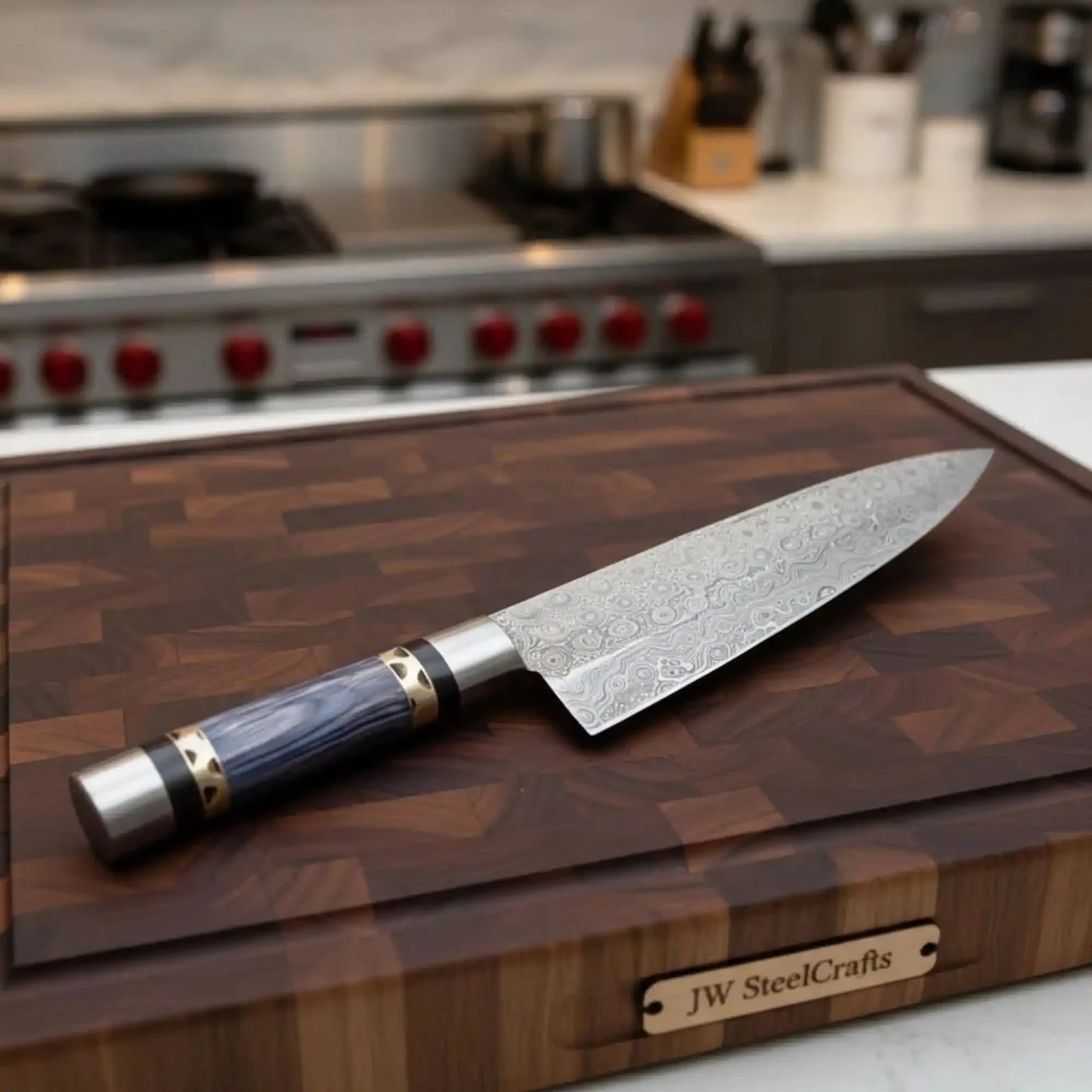 Handmade damascus steel knife with wood handle on dark surface