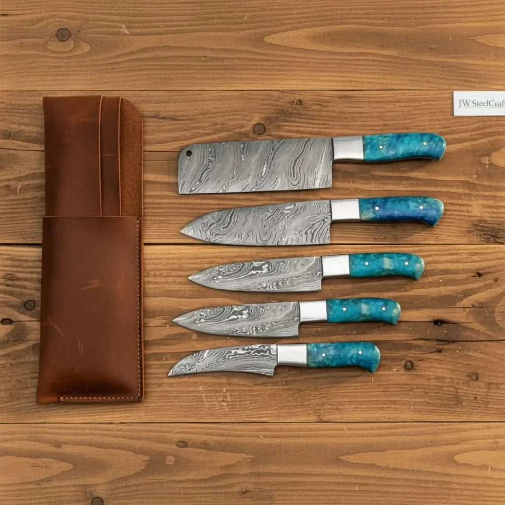 Handmade damascus steel knife with resin handle on dark surface