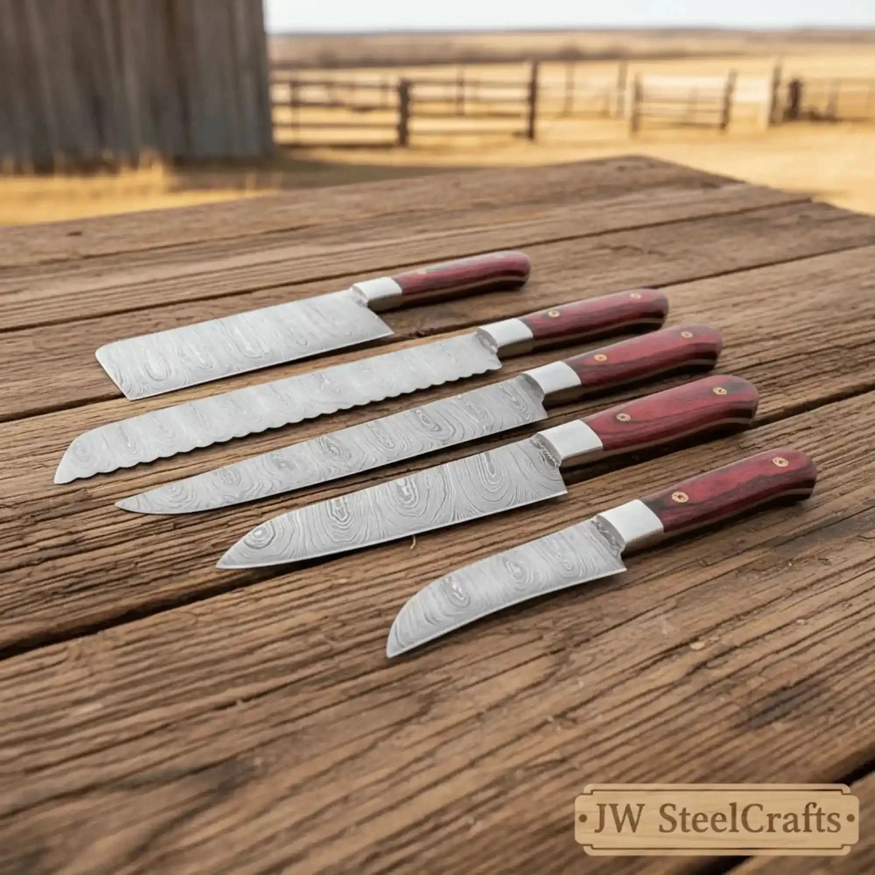 Handmade damascus steel knife with premium handle on dark surface