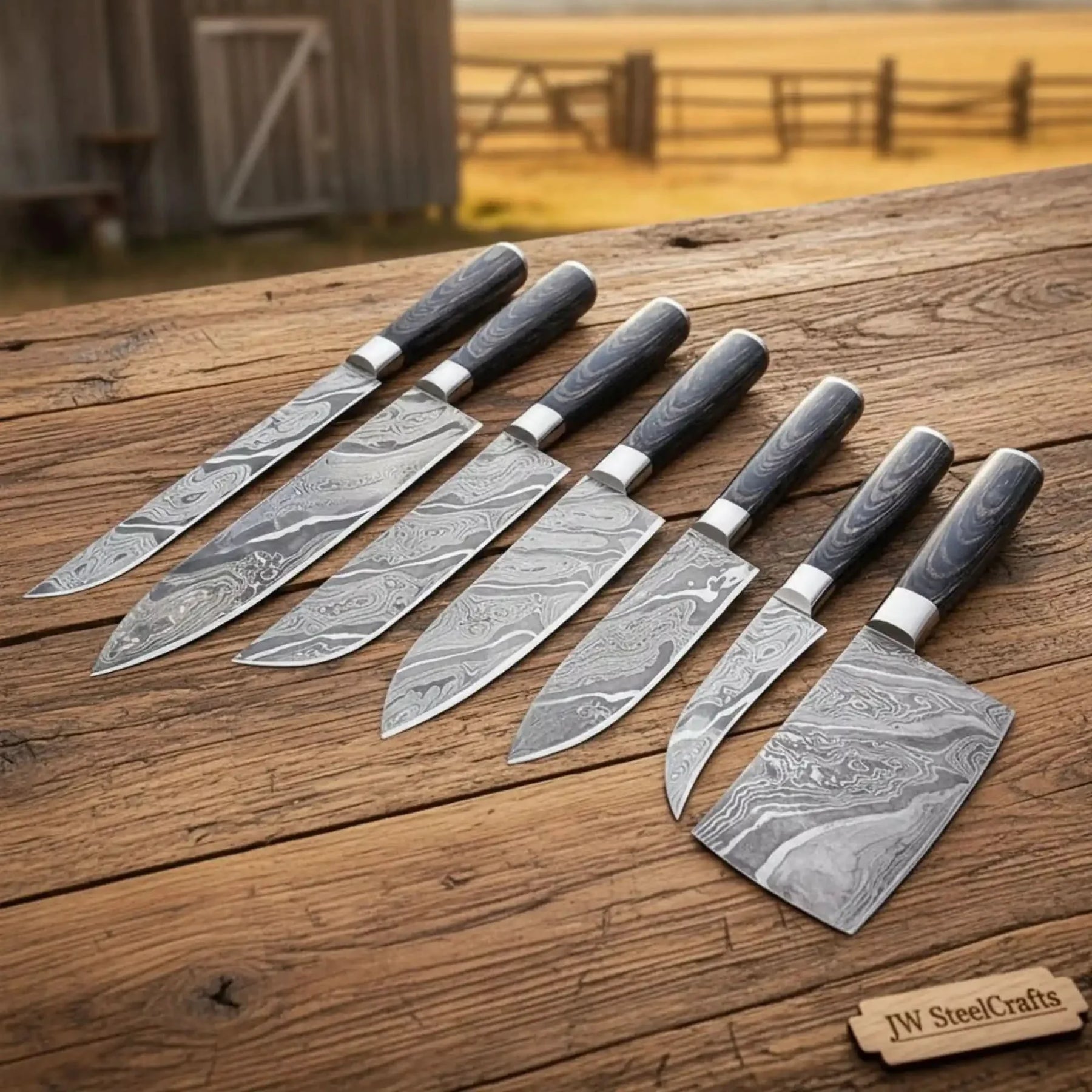 Handmade damascus steel knife with wood handle on dark surface