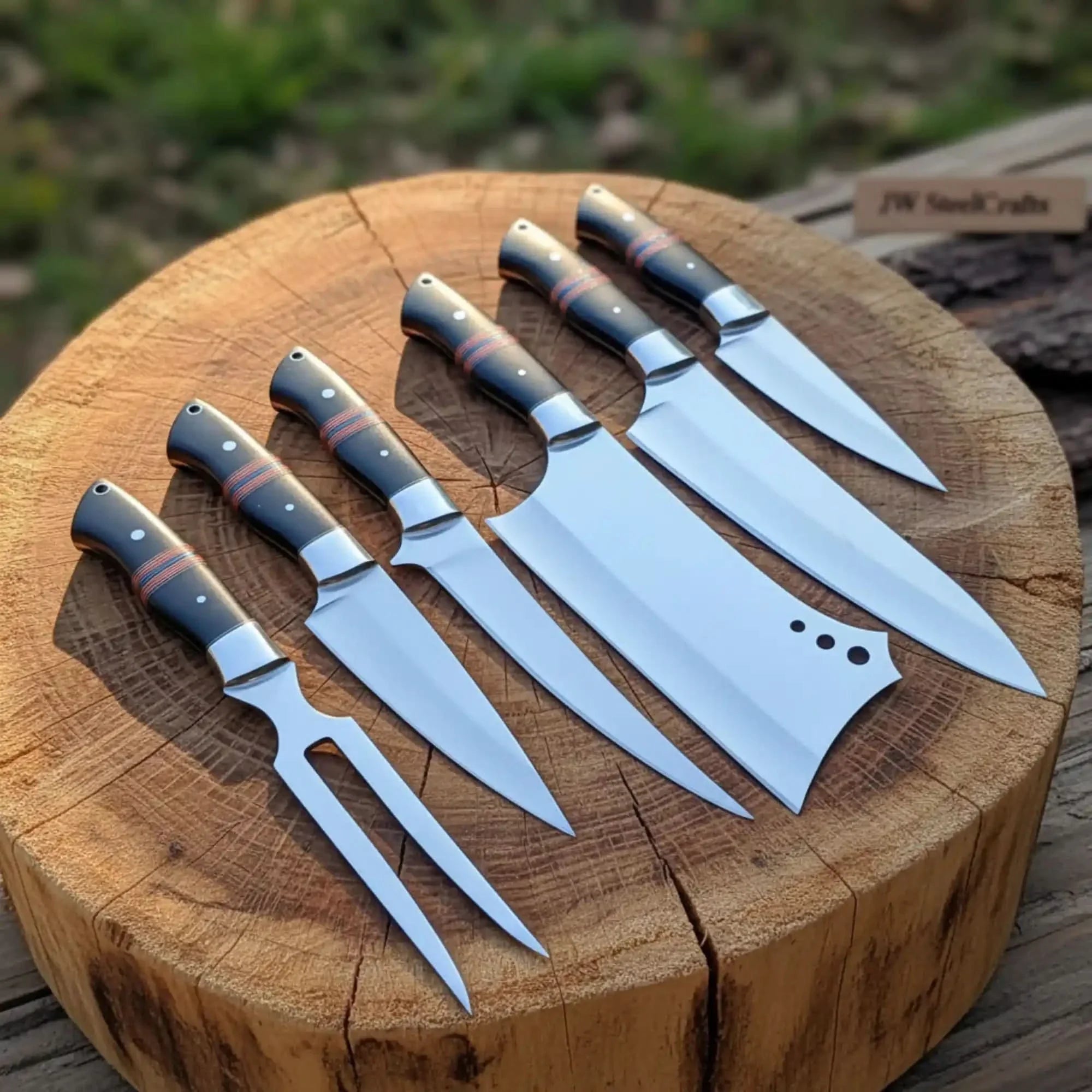 Handmade damascus steel knife with wood handle on dark surface