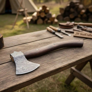 Damascus steel axe head with wood handle on rustic wood surface