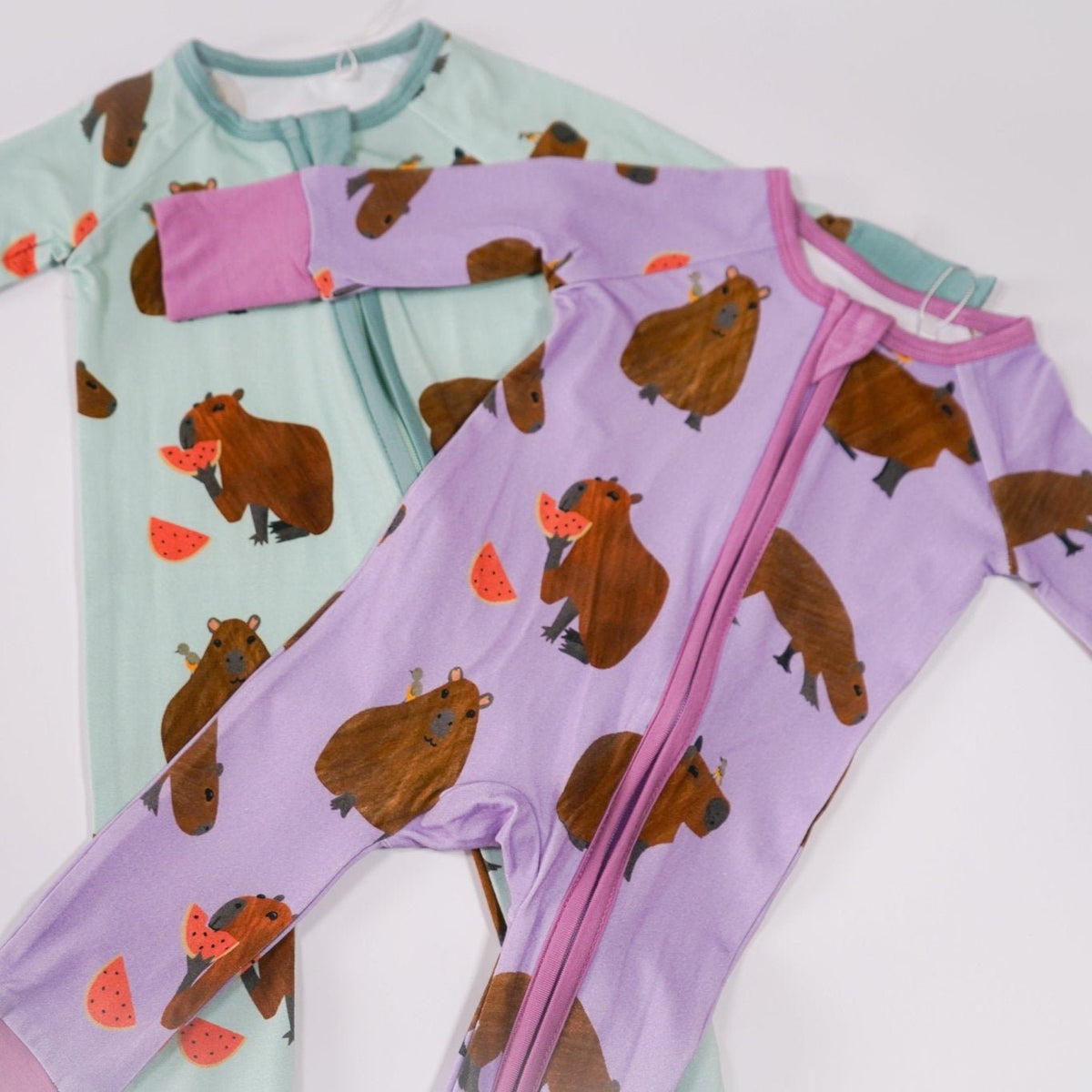 Capybara bamboo baby zip pajamas with hand drawn animal print
