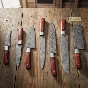 Handmade damascus steel knife with wood handle on dark surface