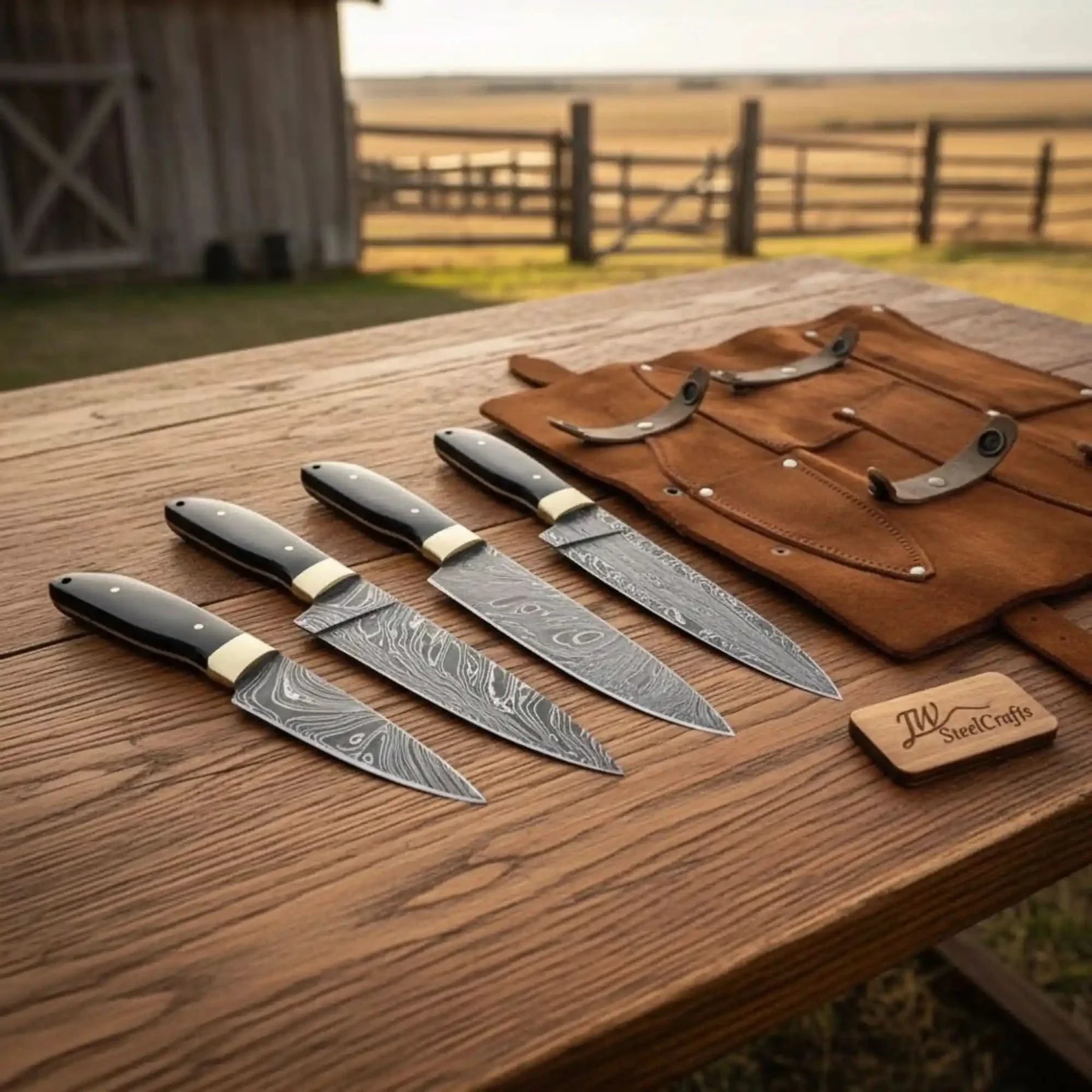 Handmade damascus steel knife with premium handle on dark surface