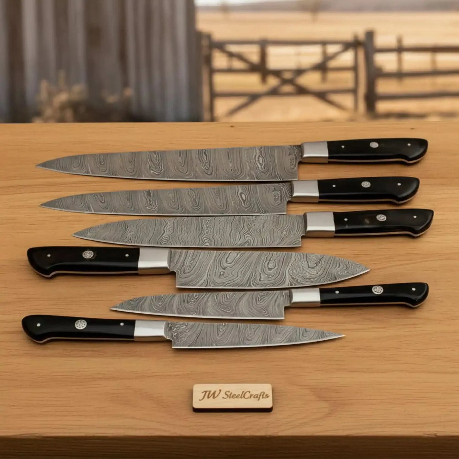 Handmade damascus steel knife with resin handle on dark surface