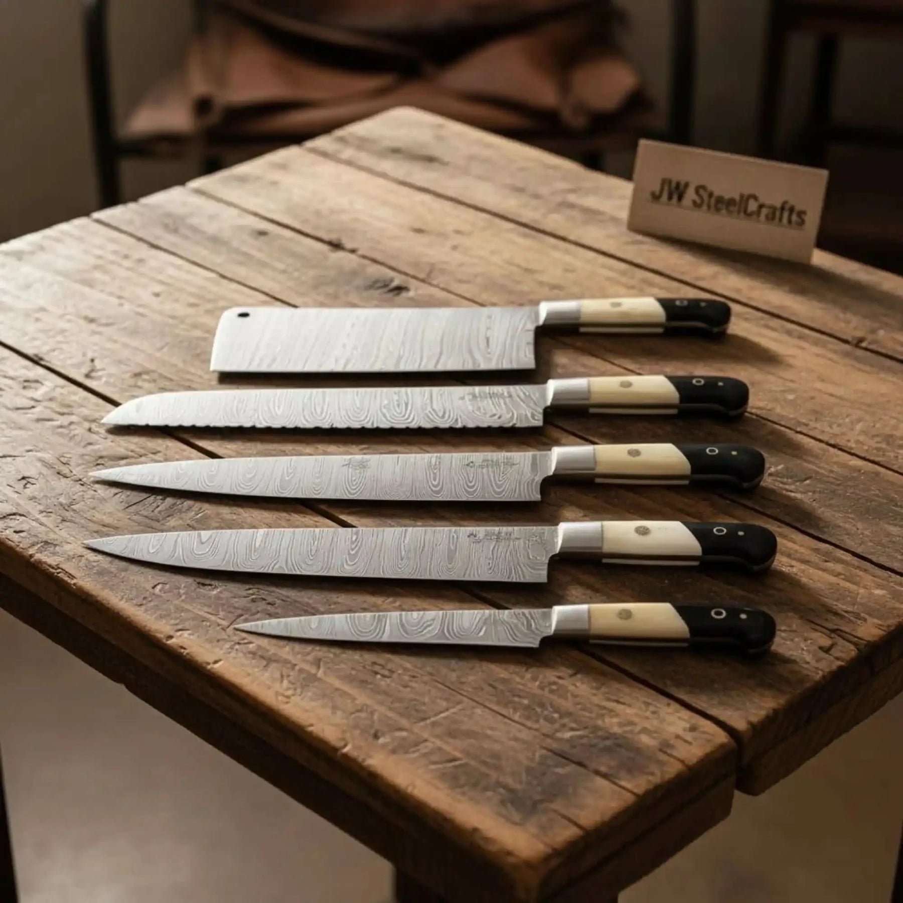Handmade damascus steel knife with wood handle on dark surface