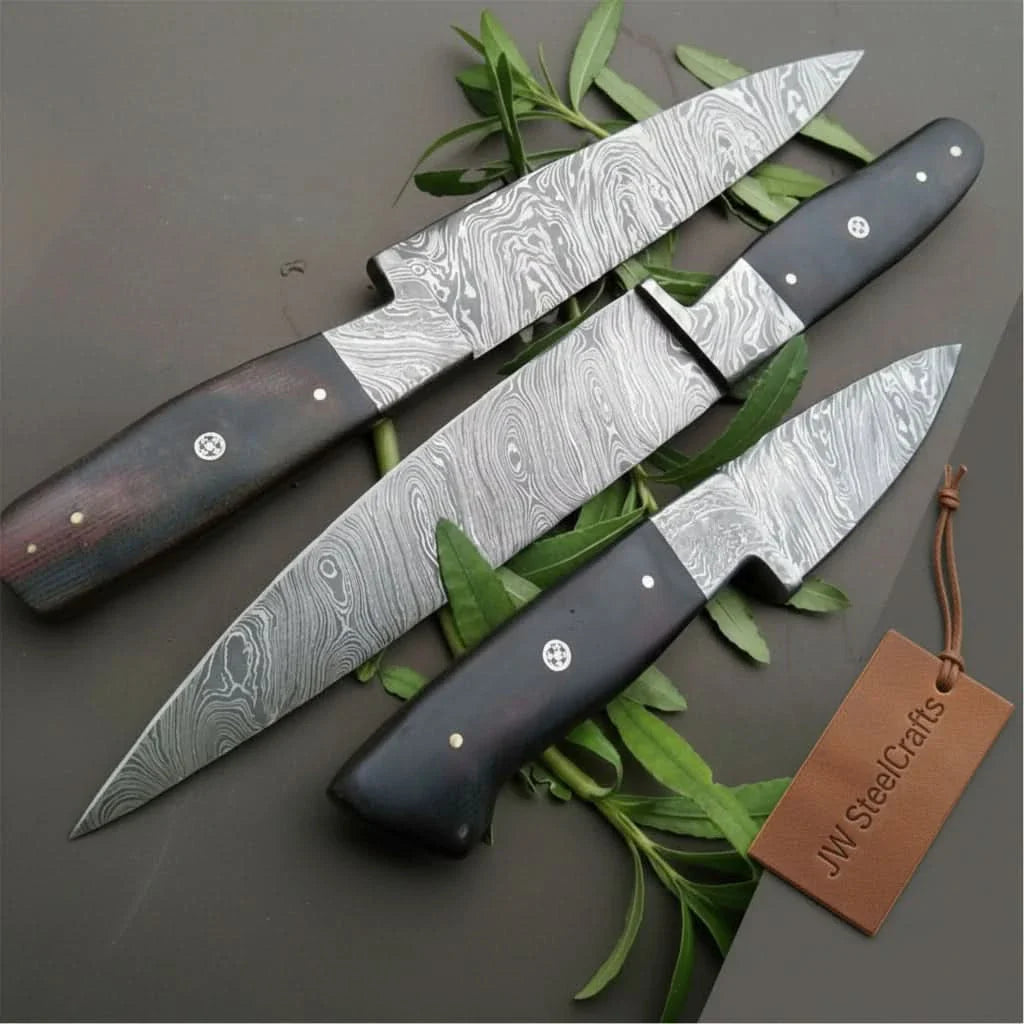 Handmade damascus steel knife with micarta handle on dark surface