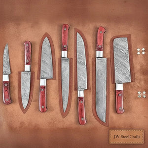 Handmade damascus steel knife with leather handle on dark surface