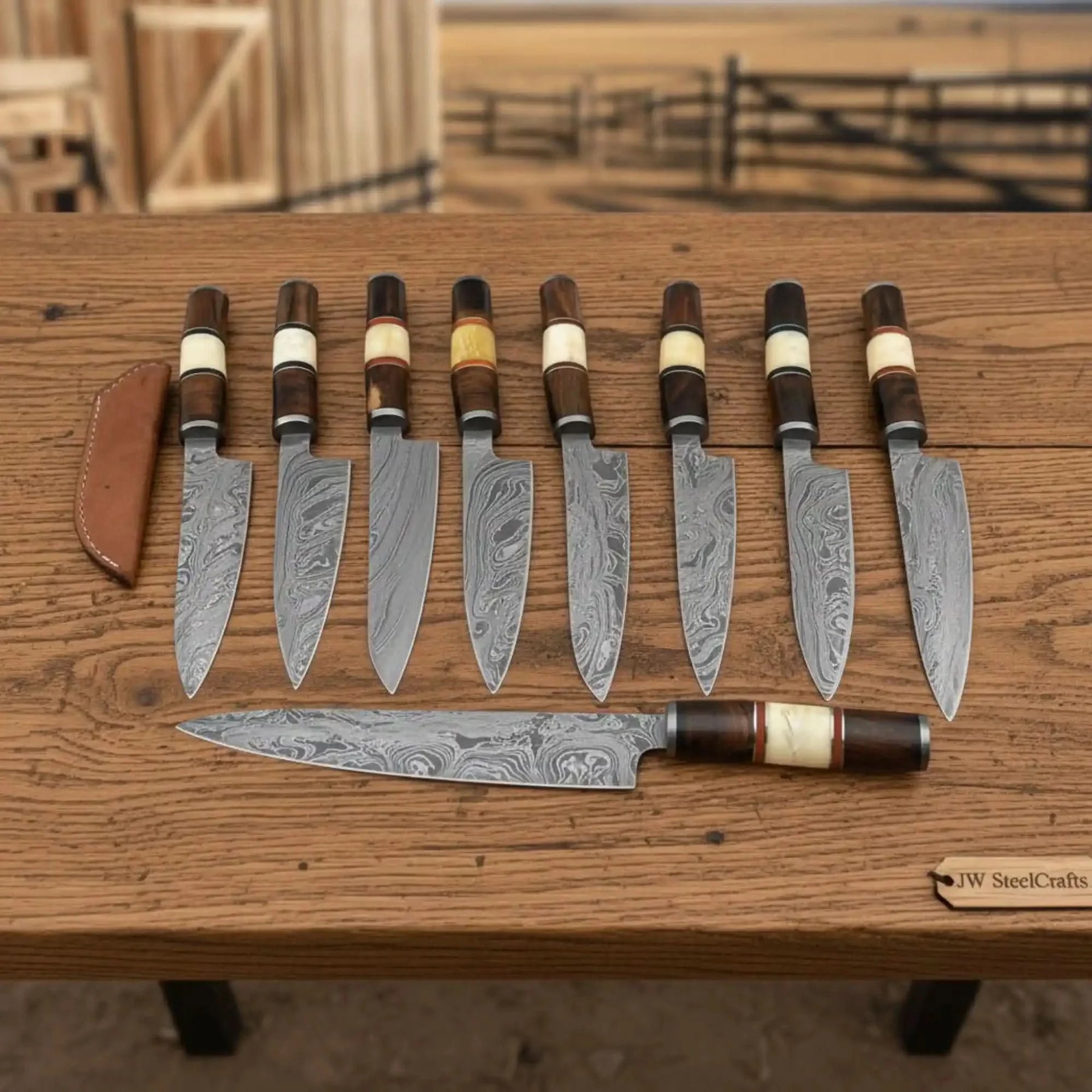 Handmade damascus steel knife with wood handle on dark surface