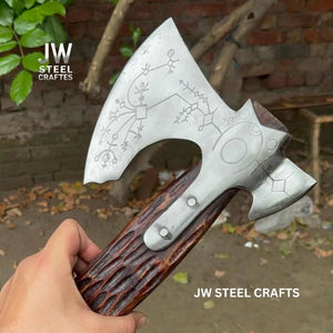 Carbon steel steel axe head with wood handle on rustic wood surface