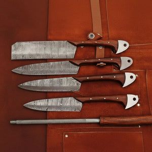Handmade damascus steel knife with wood handle on dark surface