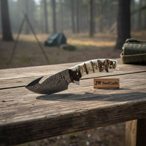 Handmade damascus steel knife with premium handle on dark surface