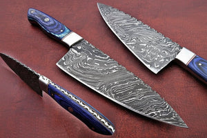 Handmade damascus steel knife with premium handle on dark surface