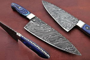Handmade damascus steel knife with premium handle on dark surface