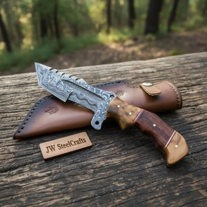 Handmade damascus steel knife with premium handle on dark surface