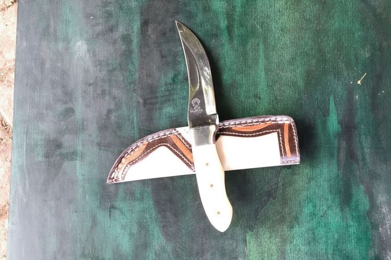 Handmade stainless steel steel knife with premium handle on dark surface