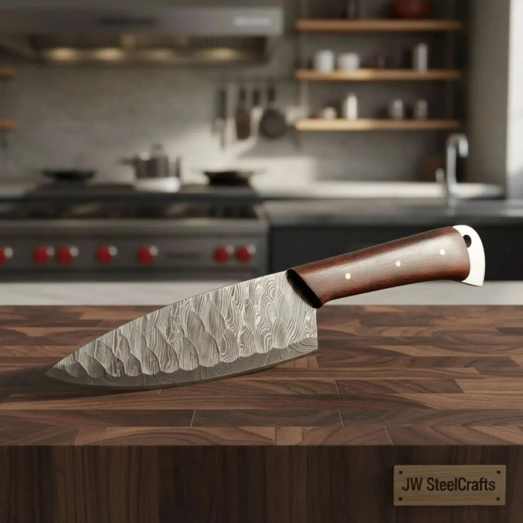 Handmade damascus steel knife with wood handle on dark surface